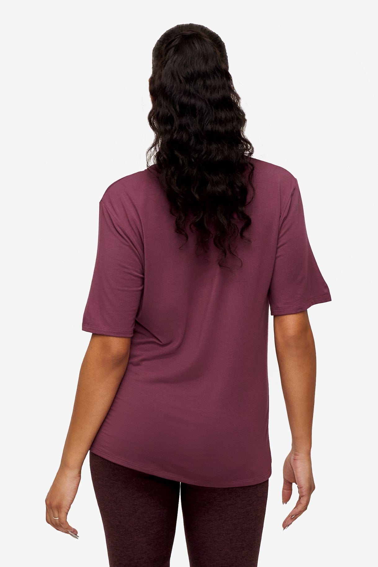 back of a woman wearing deep pink v-neck short sleeve t-shirt