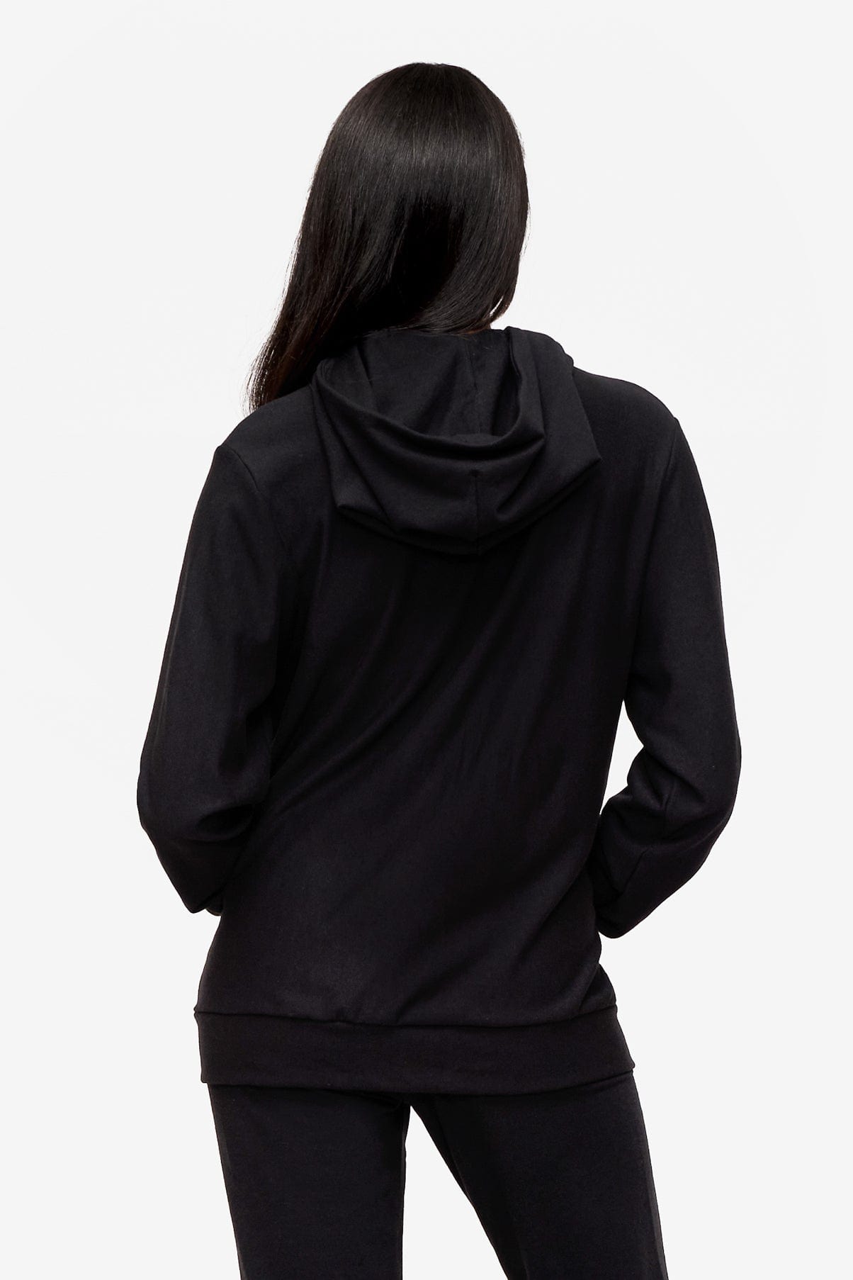 back of a woman wearing a black zipped hoodie