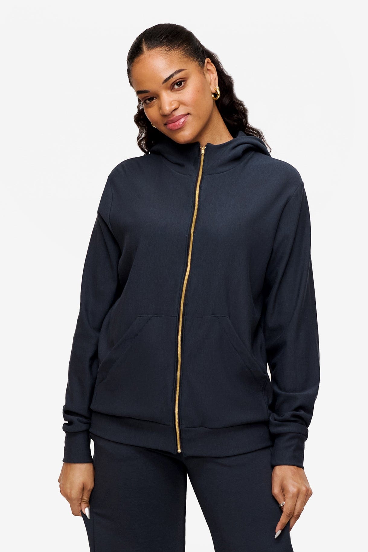 woman wearing full zip hoodie in dark blue