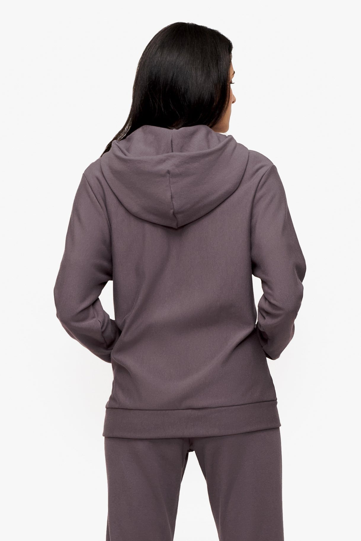 back of a woman wearing full zip hoodie in deep purple