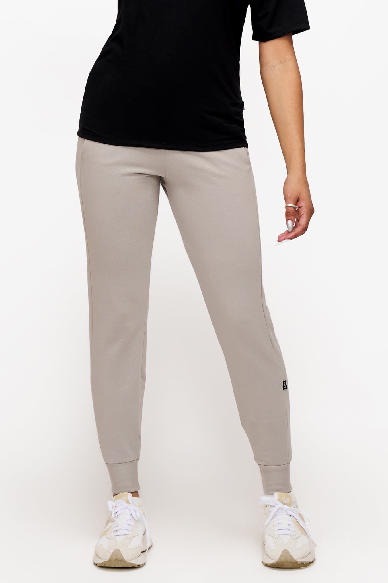 woman wearing light grey sweatpants