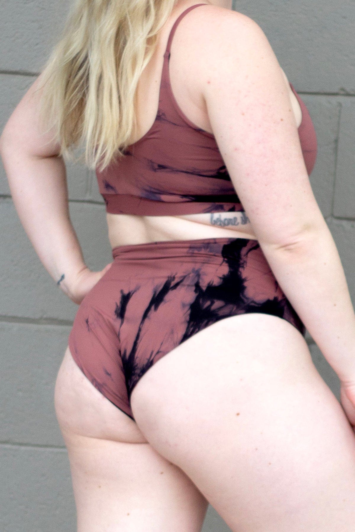 Woman wearing tie-dye matching swimsuit
