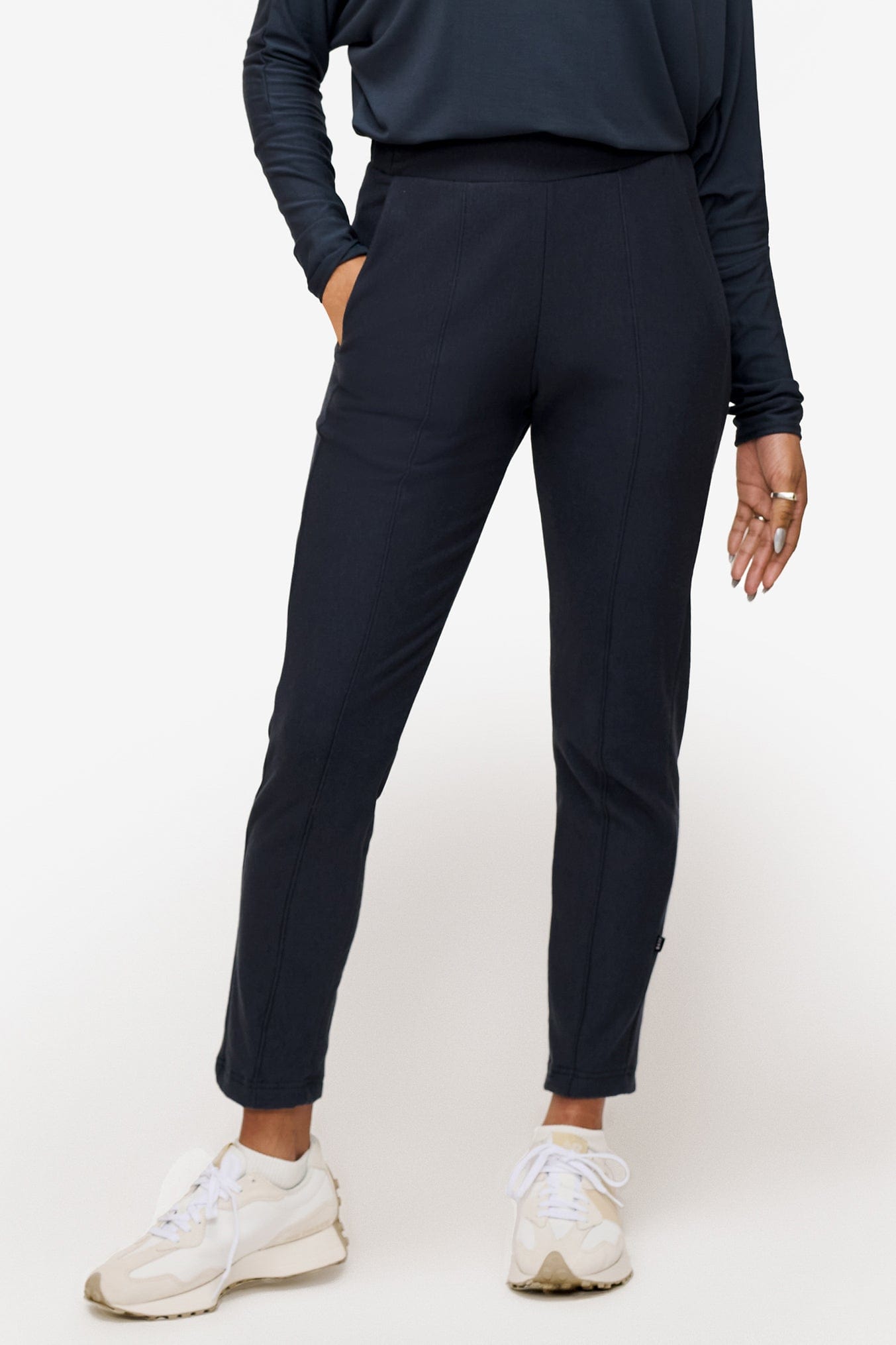 woman wearing dark blue dressy pants