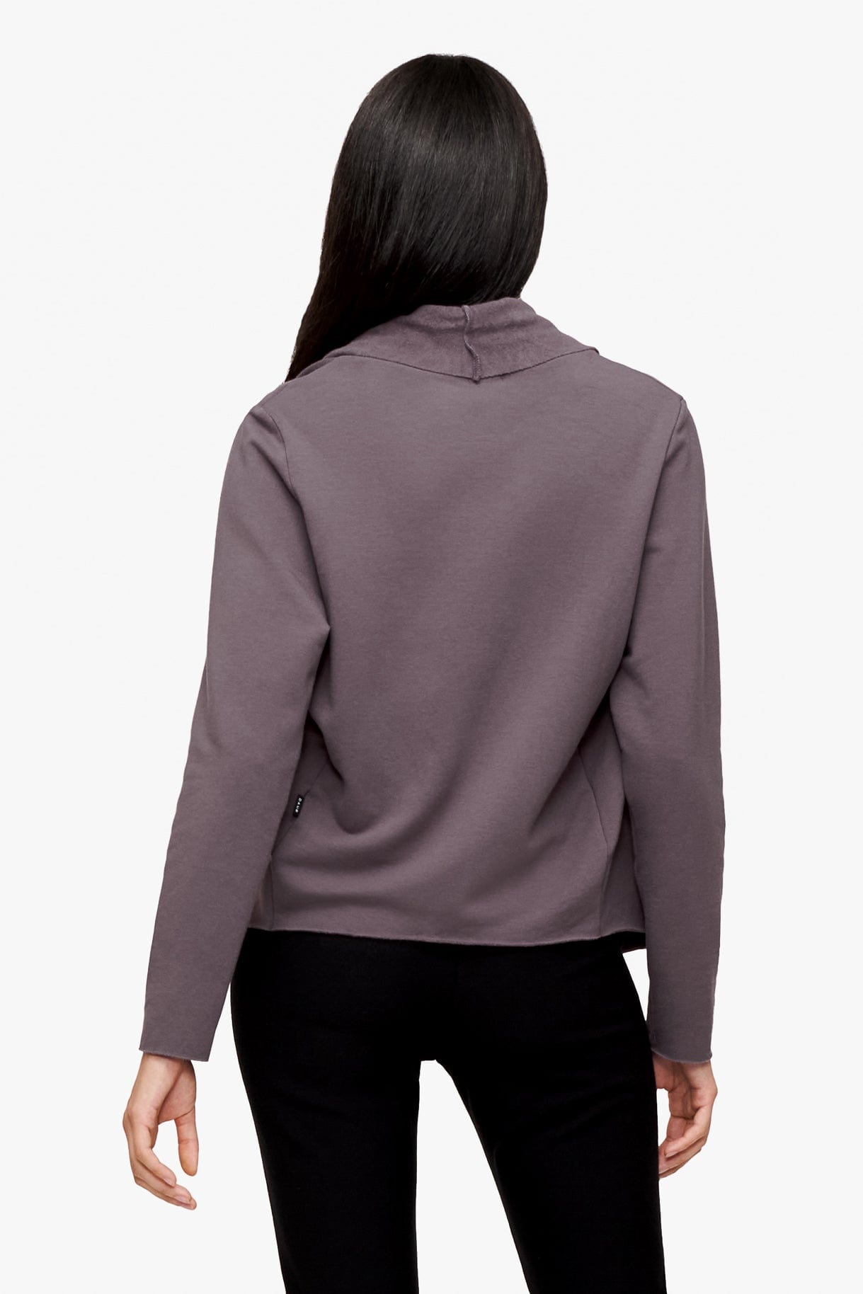 back of a woman wearing a deep purple jacket