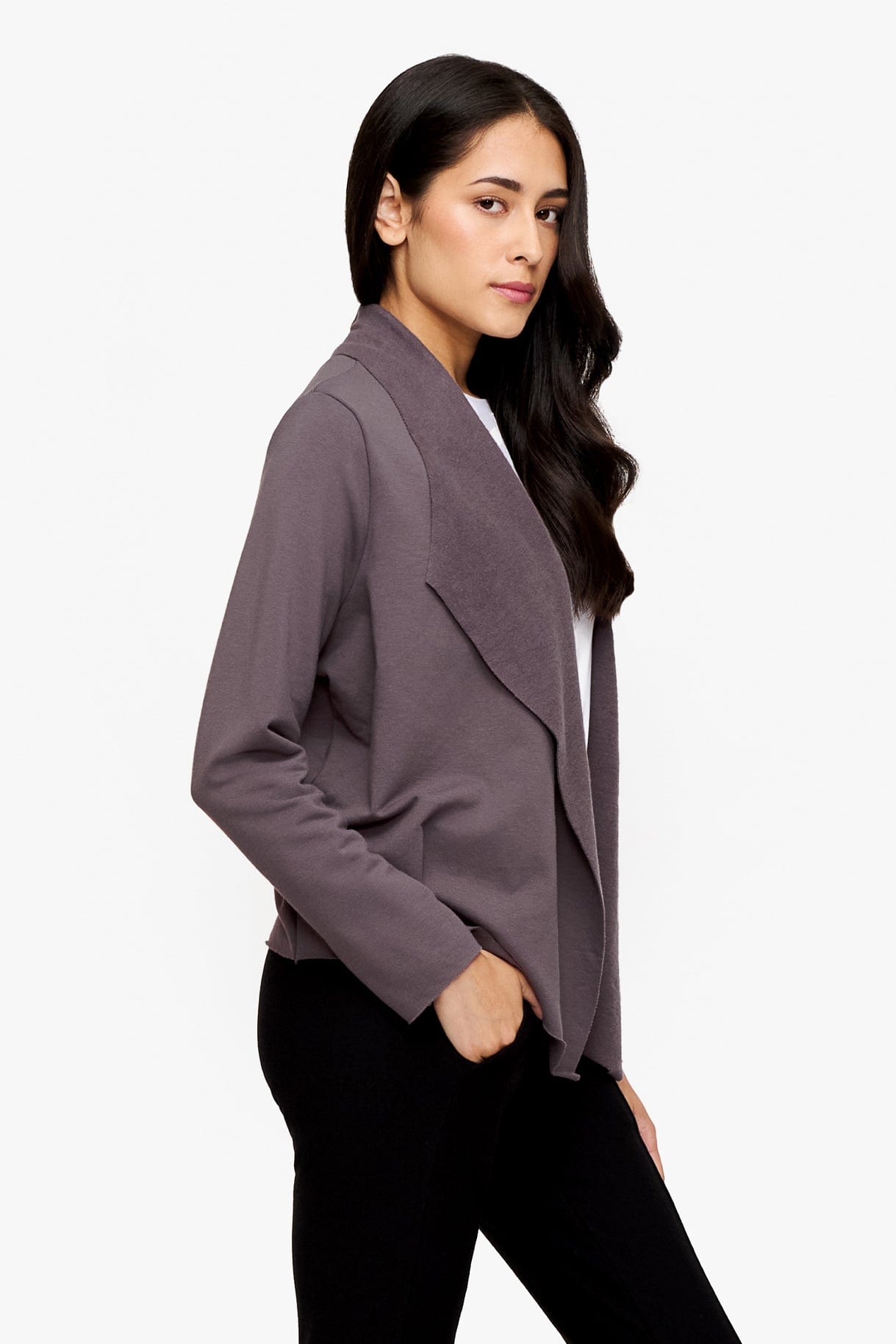 side of a woman wearing a deep purple jacket