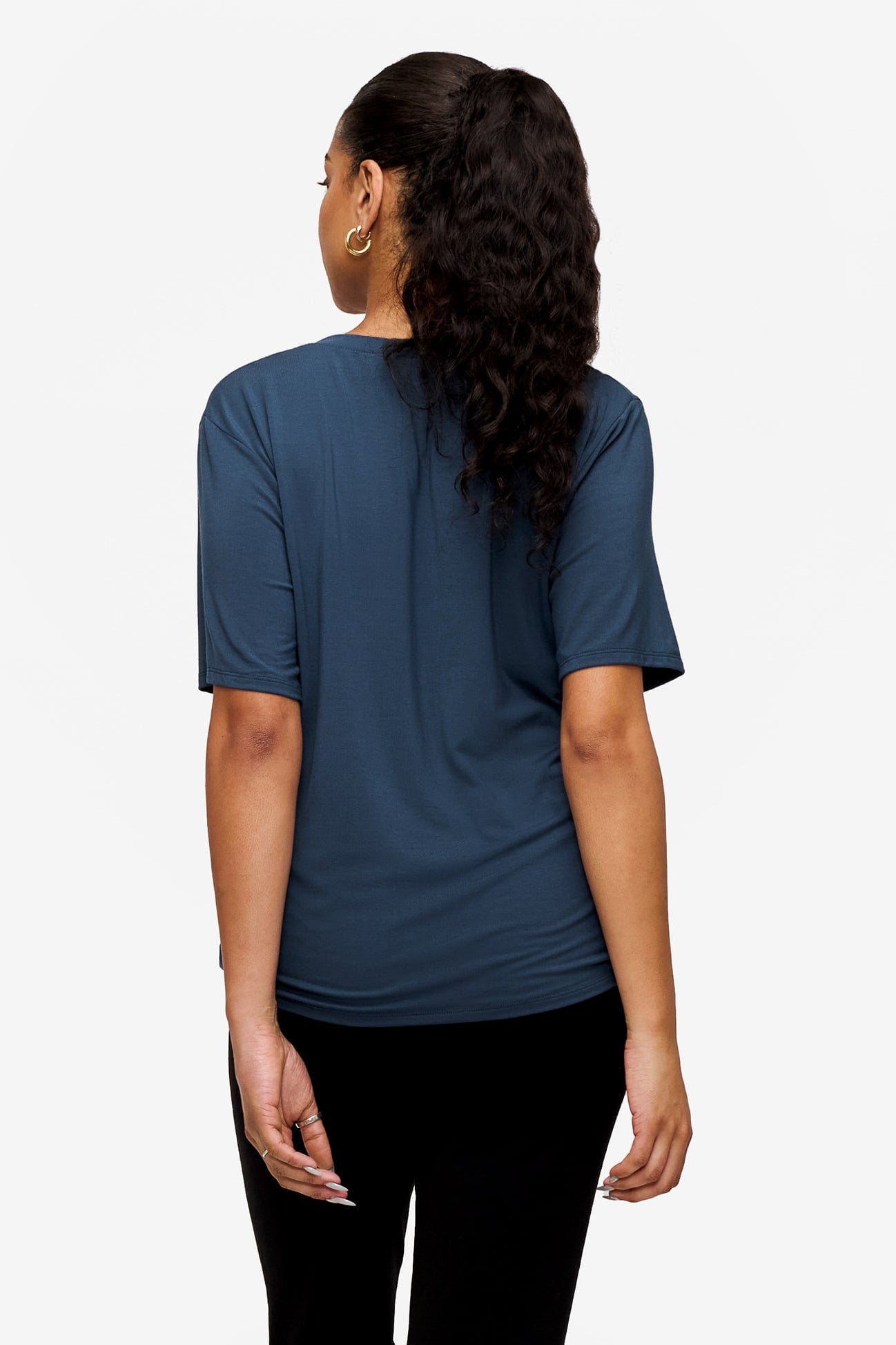 back of a woman wearing blue v-neck short sleeve t-shirt