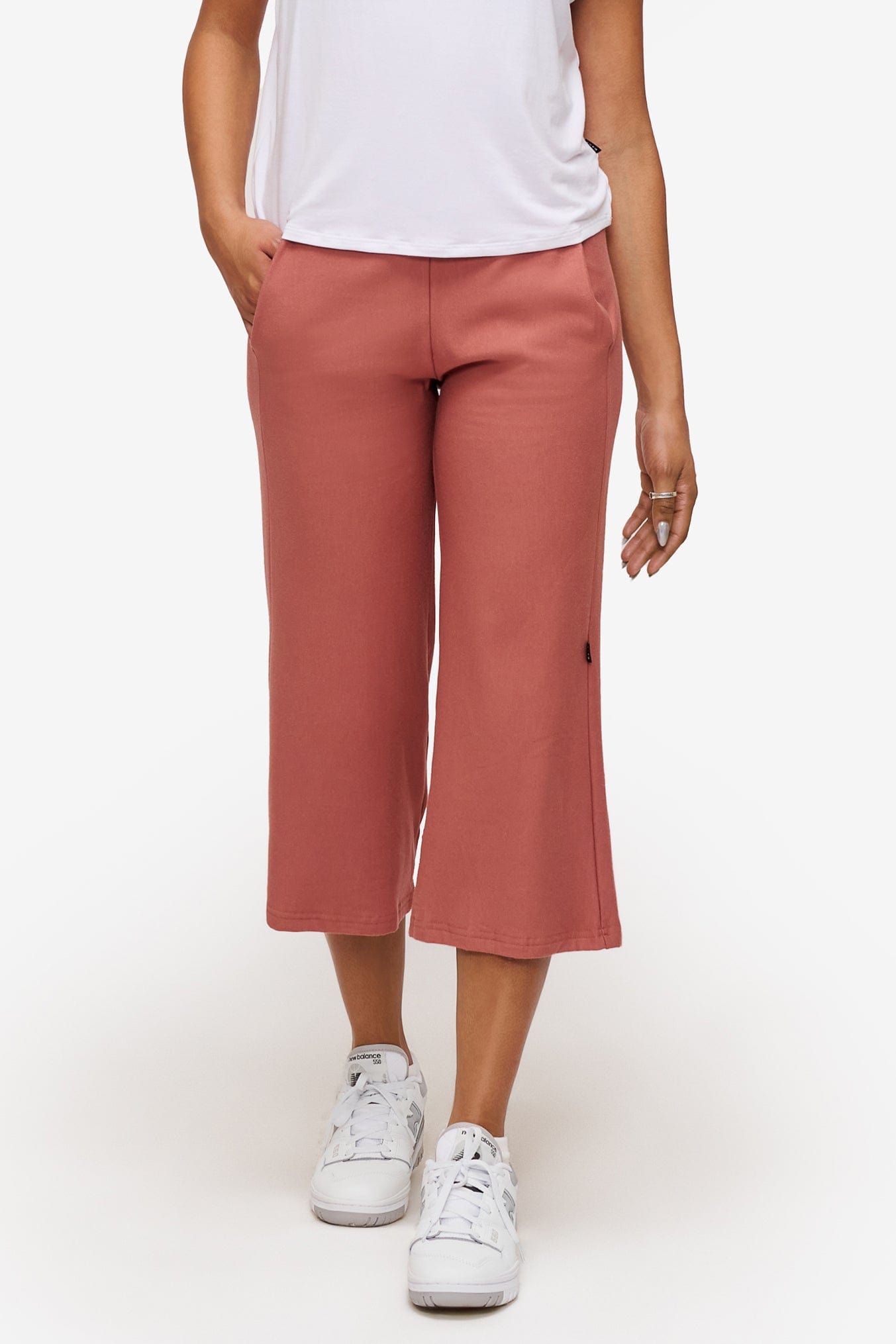 woman wearing orange cropped sweatpants