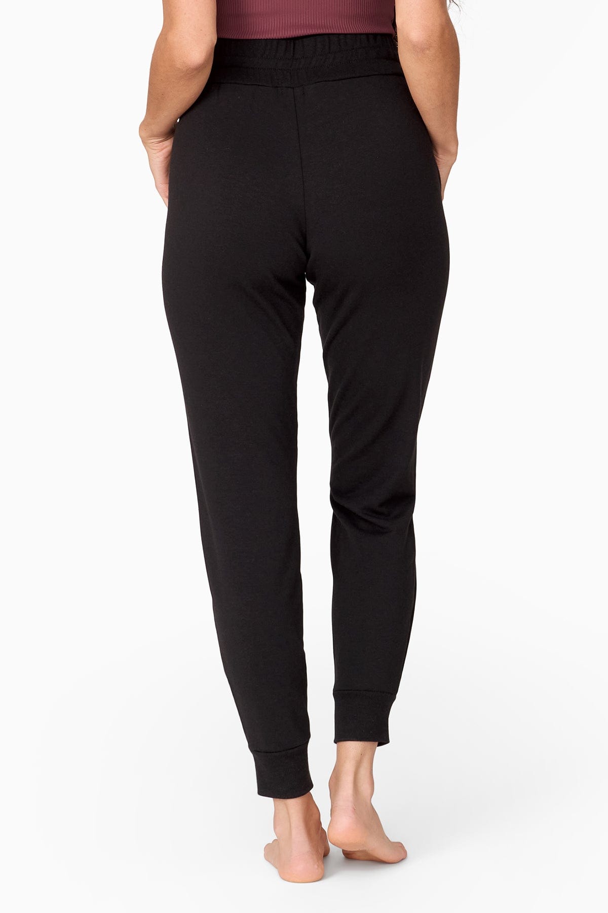 a woman wearing black joggers