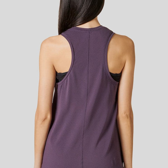 Back of woman wearing a Deep Purple Alex Tank paired with the Signature Legging in Fig