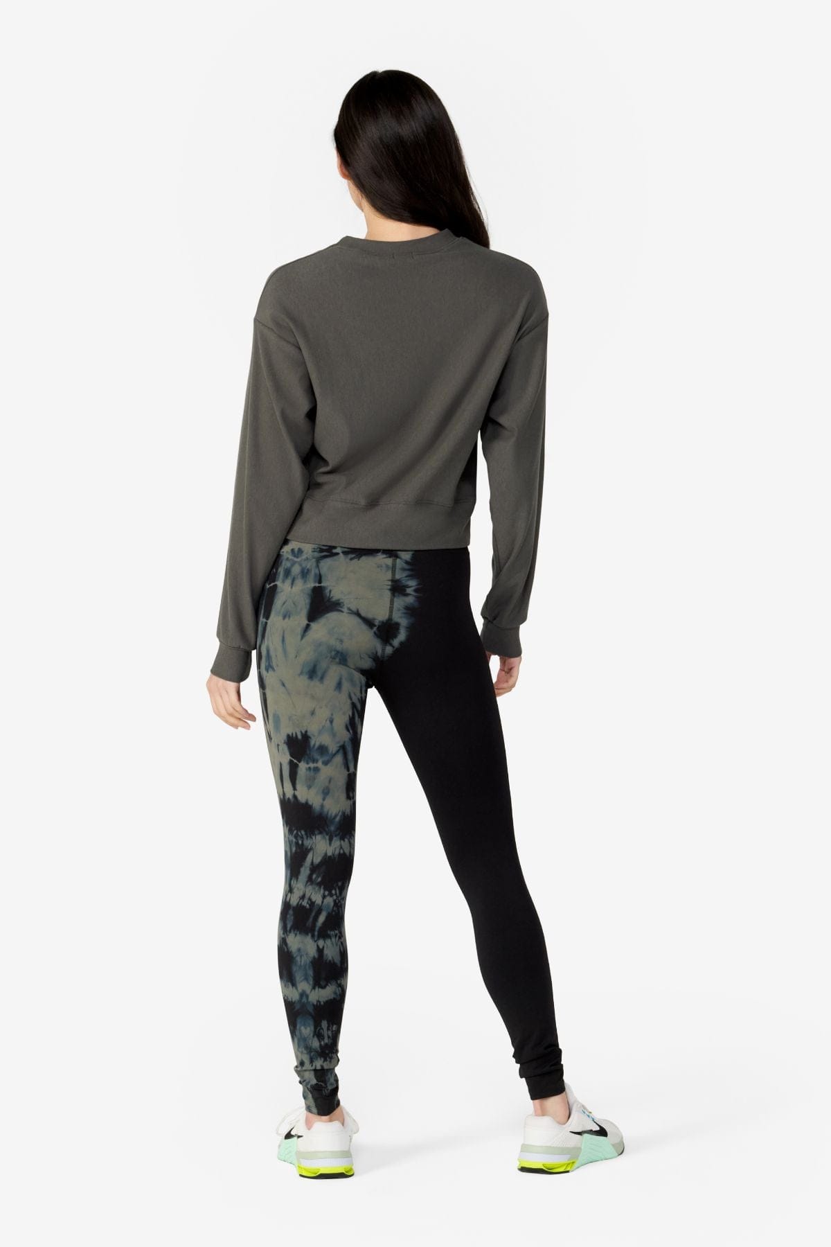 girl back side wearing a dark green long sleeves sweater