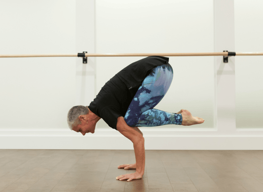 crow pose yoga in tie dye leggings made in vancouver