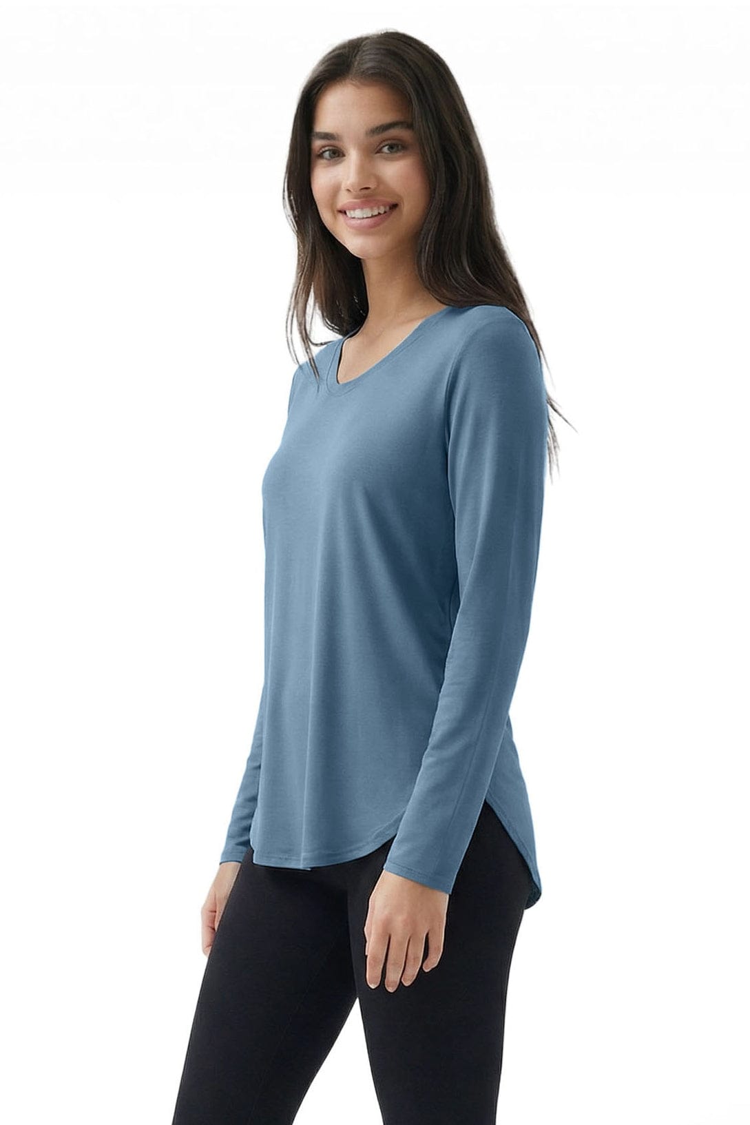 Woman wearing a blue long-sleeve top on a white background