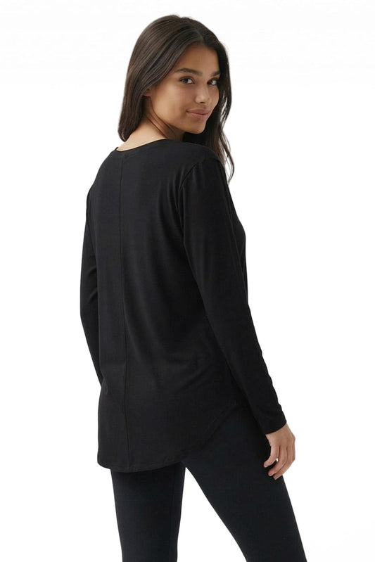 Woman wearing a black long-sleeve top on a white background