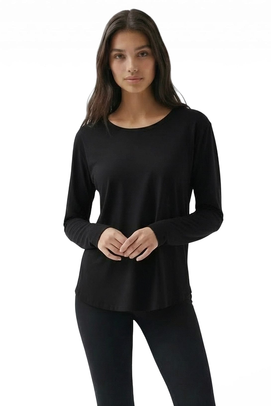 Woman wearing a black long-sleeve top on a white background