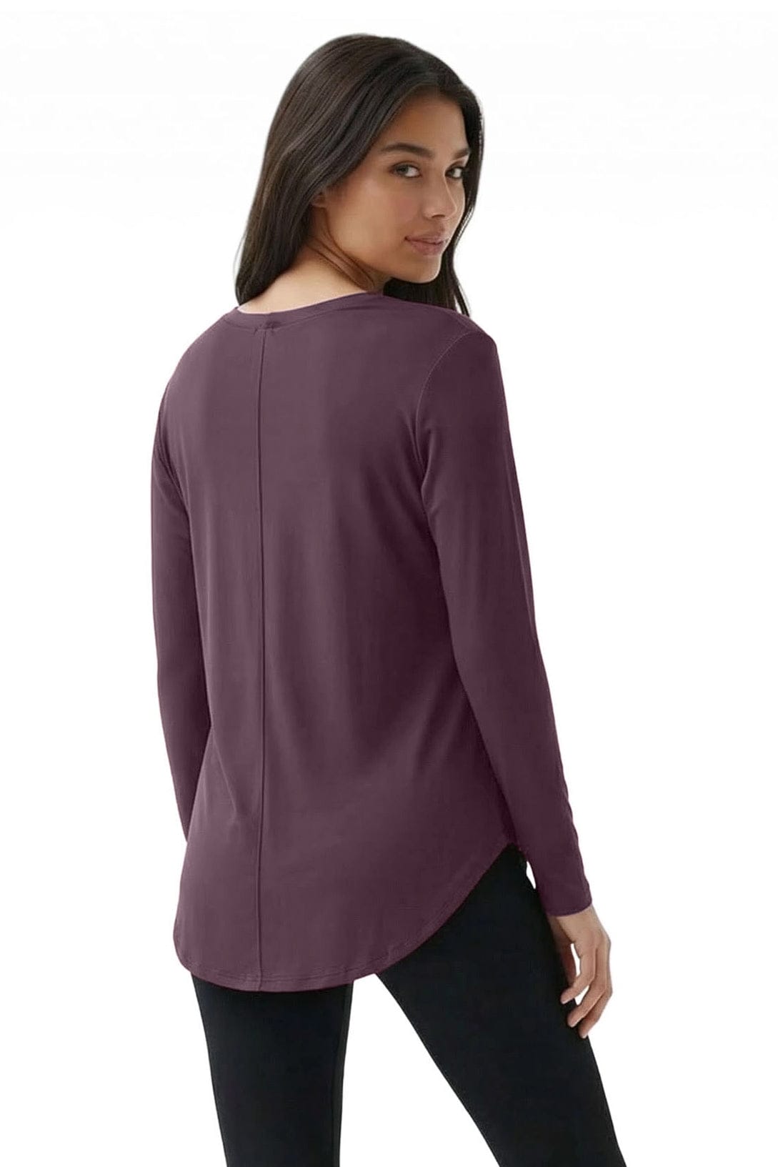 Woman wearing a purple long-sleeve top on a white background