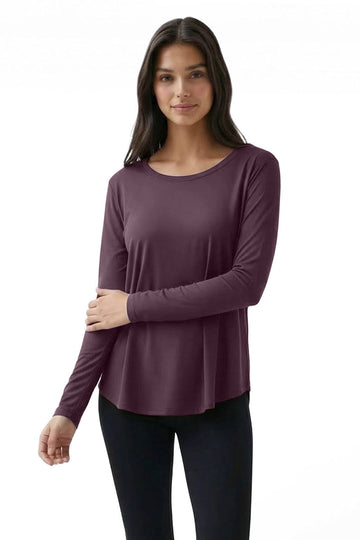 Woman wearing a purple long-sleeve top on a white background