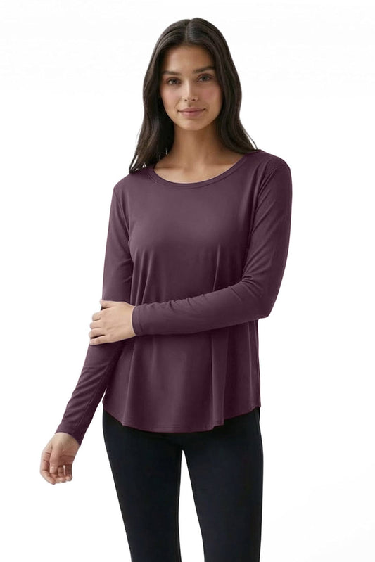 Woman wearing a purple long-sleeve top on a white background