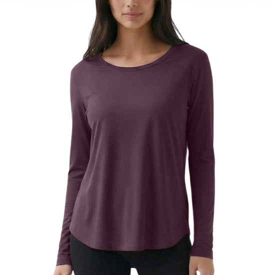 Woman wearing a purple long-sleeve top on a white background