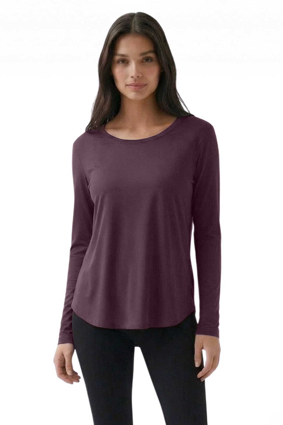 Woman wearing a purple long-sleeve top on a white background