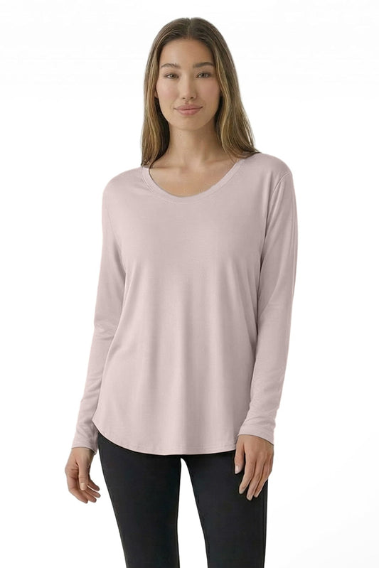 Woman wearing a light pink long-sleeve top on a white background