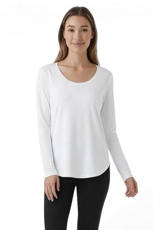 Woman wearing a white long-sleeve top and black pants on a white background