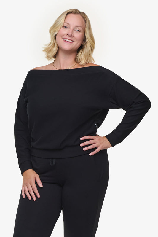 Boatneck Sweatshirt - Woman off shoulder sweatshirt in black front | Daub & Design