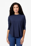 Woman wearing a navy 3/4 length sleeve shirt