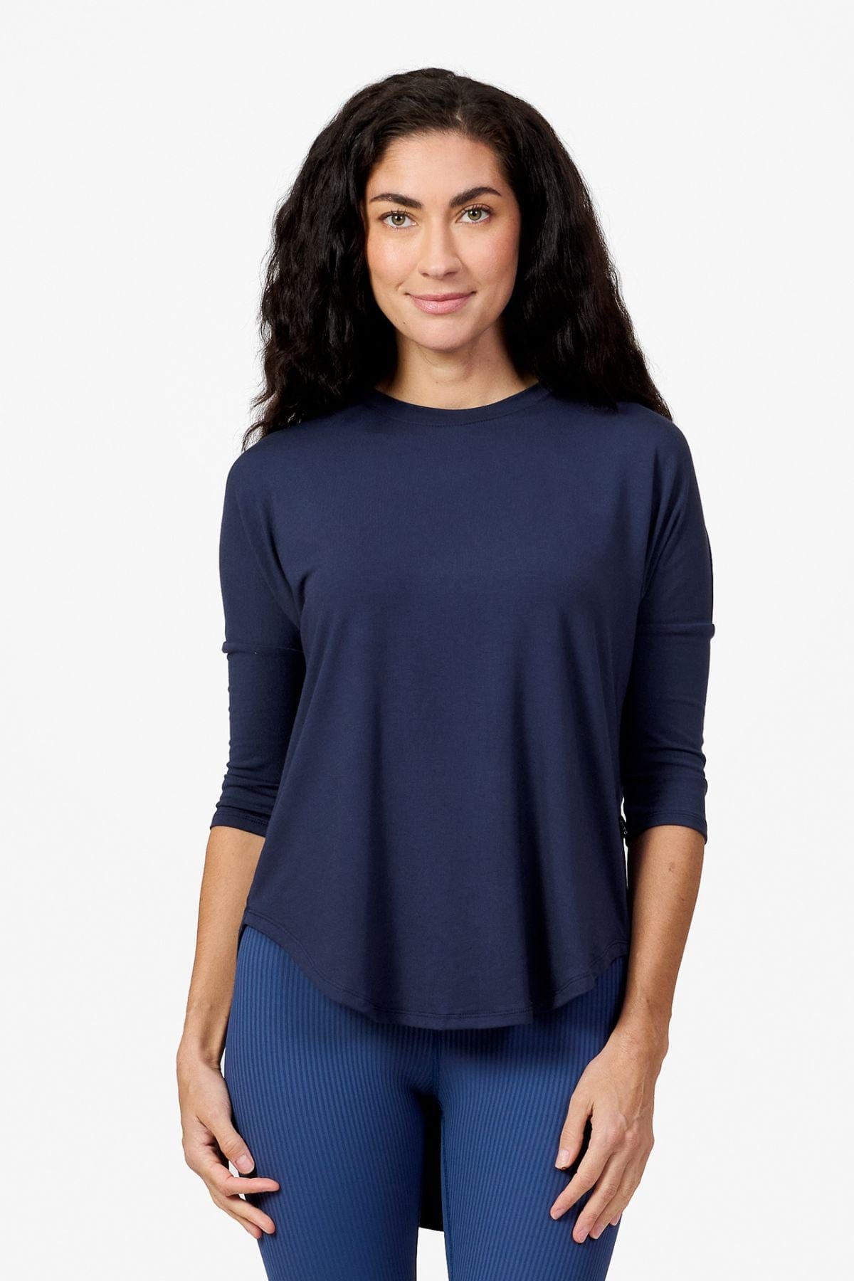 Woman wearing a navy 3/4 length sleeve shirt