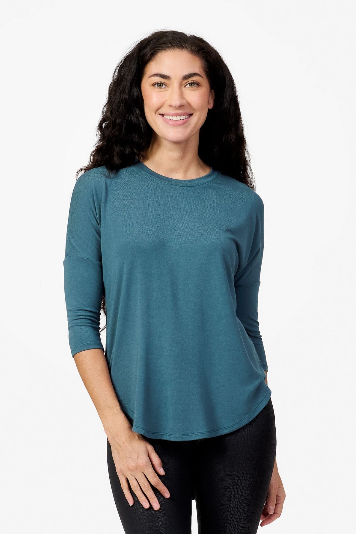 Woman wearing a Teal 3/4 length sleeve shirt