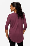 back of a woman wearing a deep pink 3/4 sleeve shirt