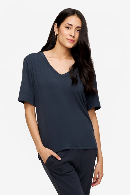 woman wearing dark blue v-neck short sleeve t-shirt