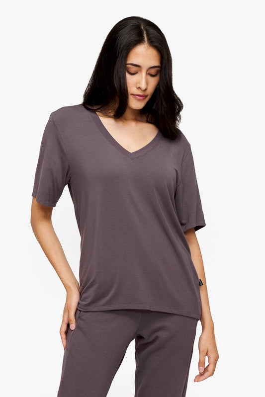 woman wearing deep purple v-neck short sleeve t-shirt