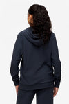 back of a woman wearing full zip hoodie in dark blue 