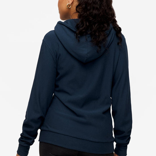 back of woman wearing full zip hoodie in blue 