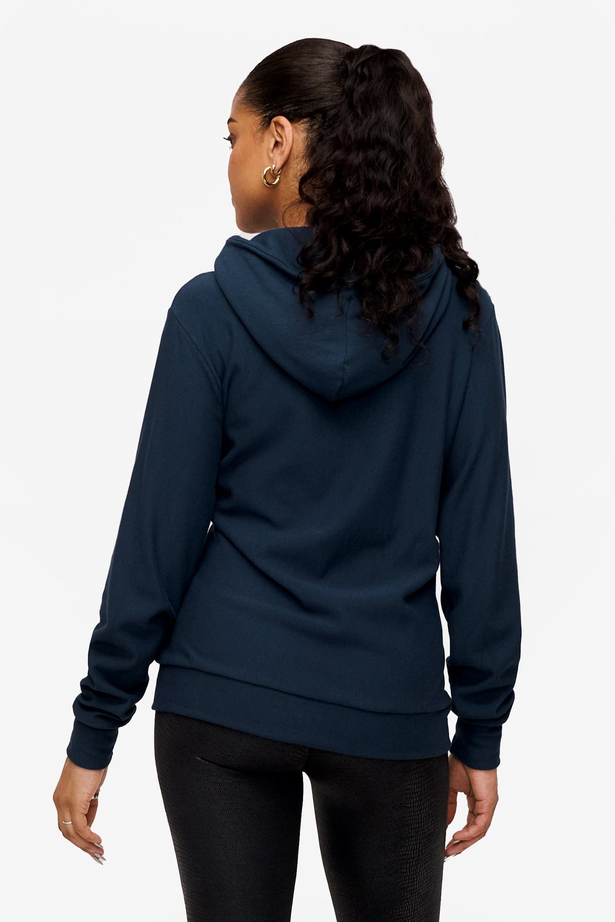 back of woman wearing full zip hoodie in blue 