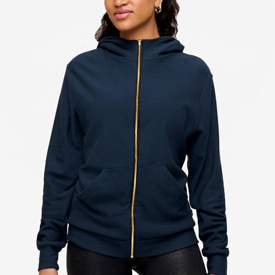 woman wearing full zip hoodie in blue 