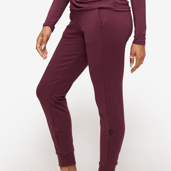 side of a woman wearing deep pink sweatpants with drawstring 