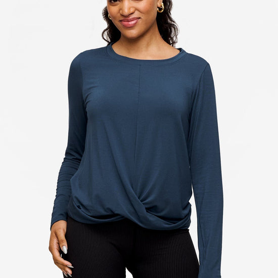 woman wearing a long sleeve shirt with a twist at the front in  blue