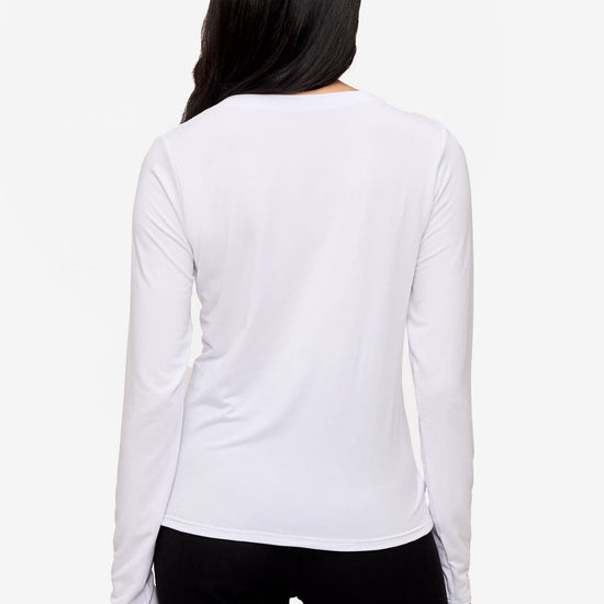 back of a woman wearing a long sleeve shirt with a twist at the front in white