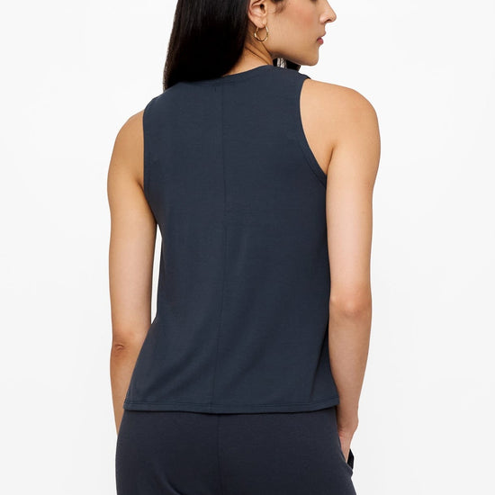 back of a woman wearing a dark blue high tank top