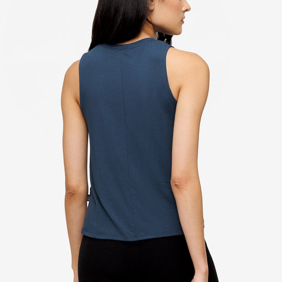 back of a woman wearing a deep blue high tank top