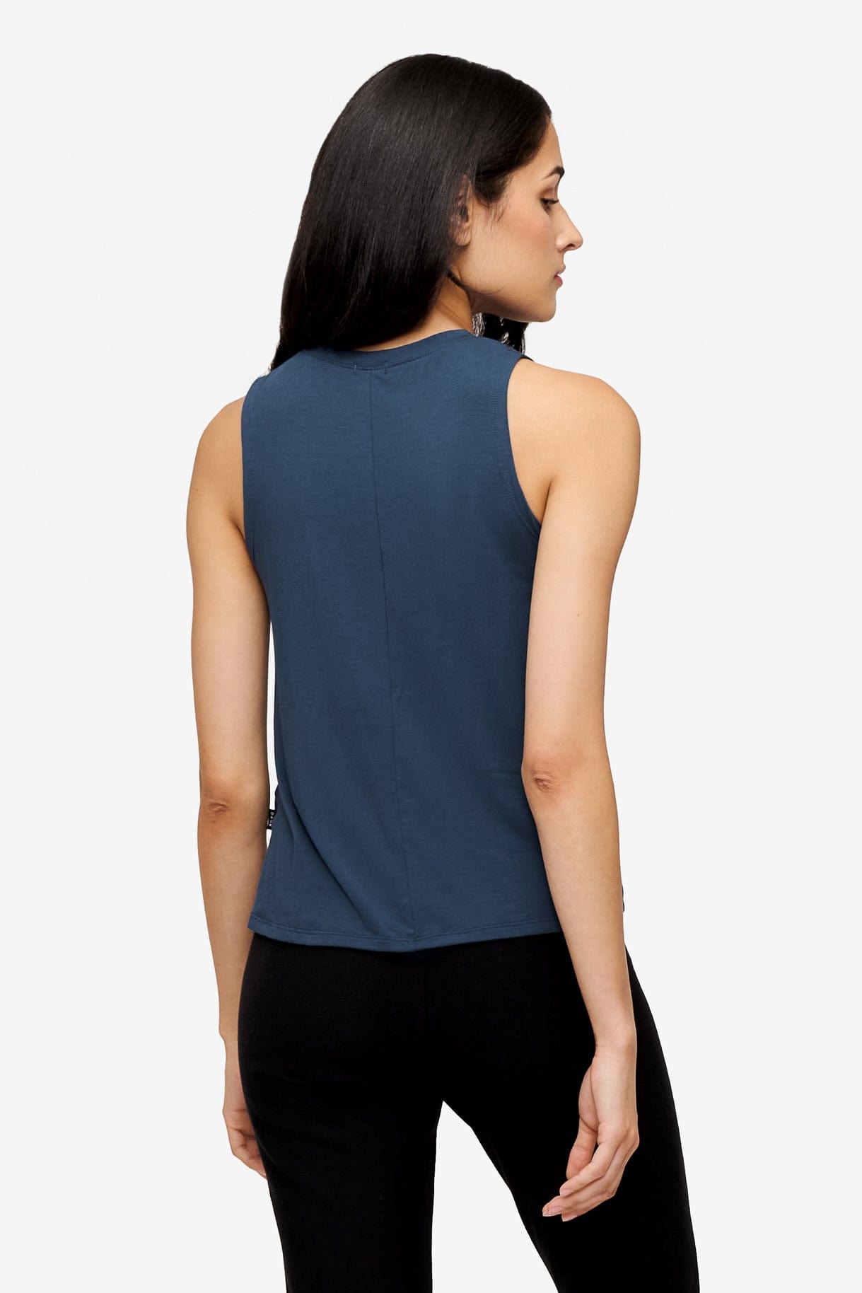 back of a woman wearing a deep blue high tank top