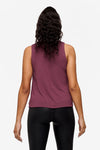 back of a woman wearing a deep blue high tank top