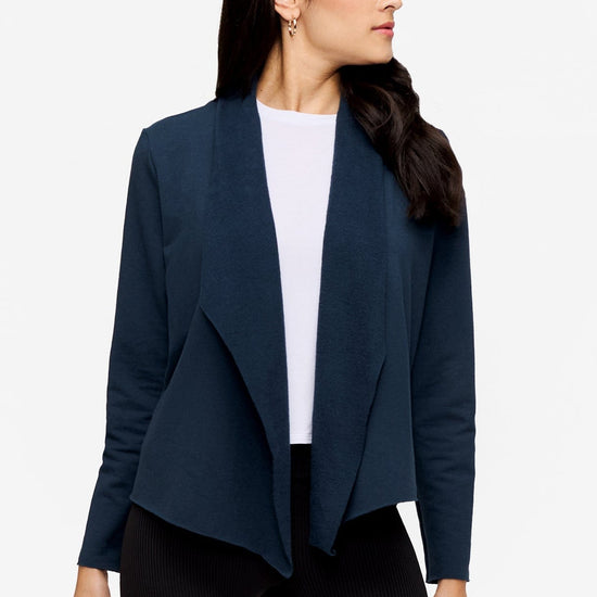 woman wearing a deep blue jacket 