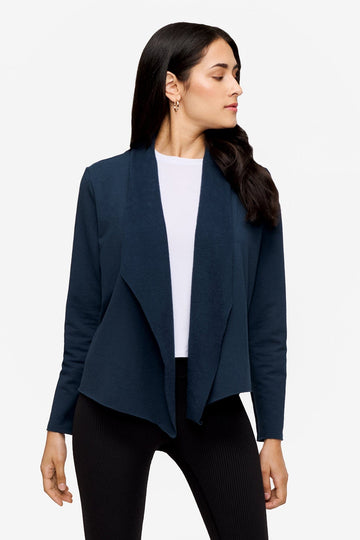 woman wearing a deep blue jacket 