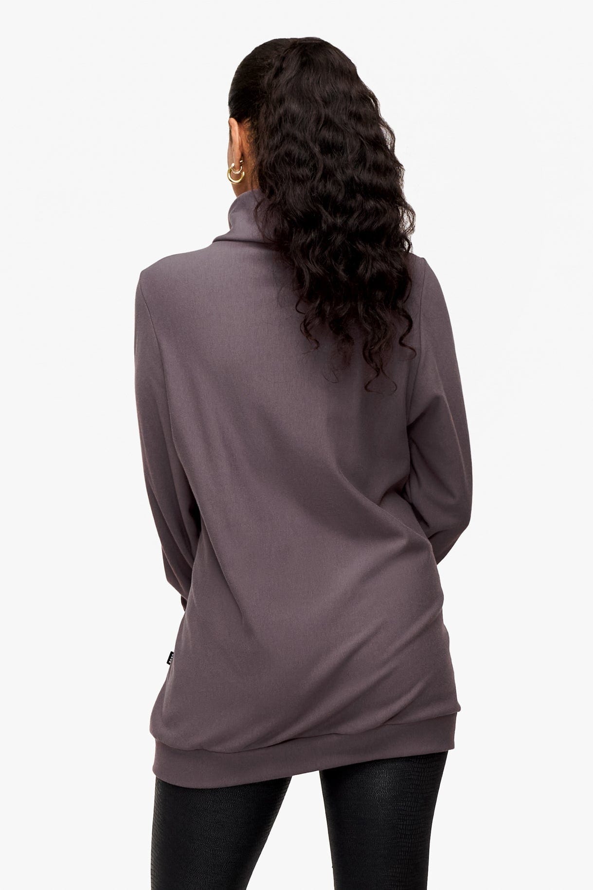 back of a woman wearing a turtleneck sweater in deep purple