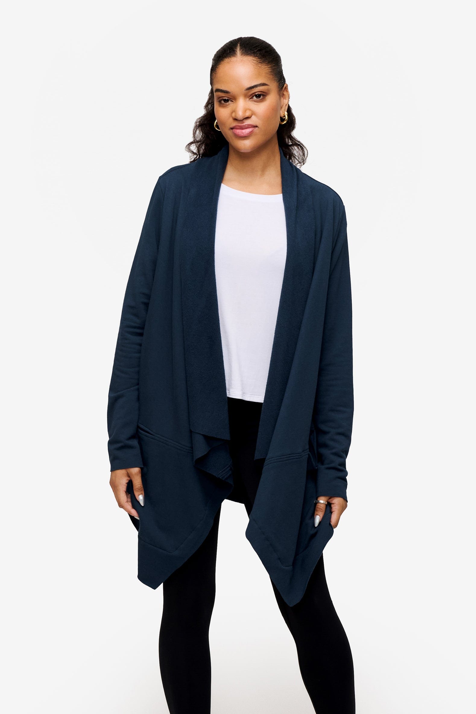 woman wearing a drapey jacket in deep blue