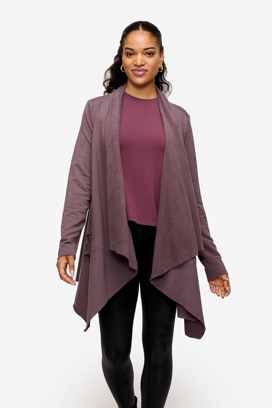 woman wearing a drapey jacket in deep purple