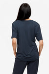 back of a woman wearing dark blue v-neck short sleeve t-shirt
