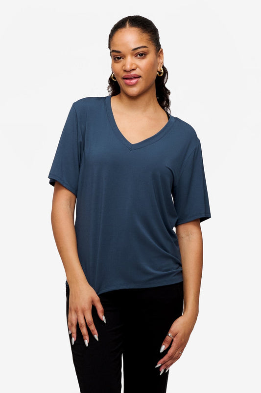 woman wearing blue v-neck short sleeve t-shirt